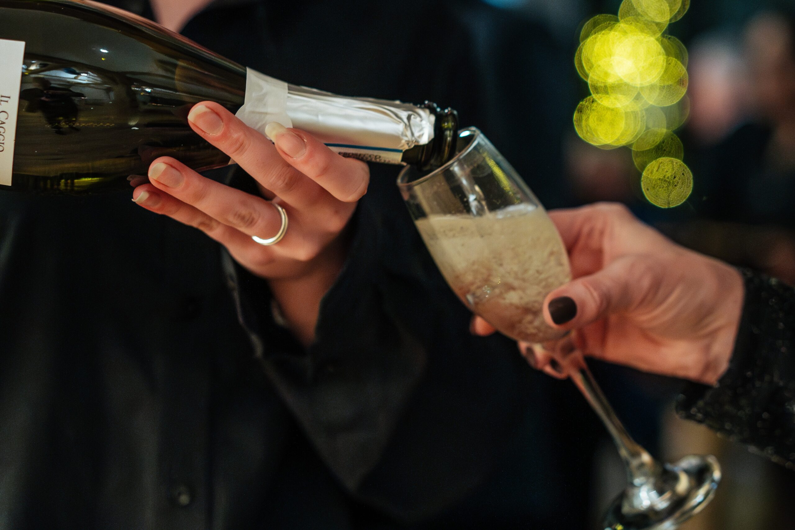 Pouring prosecco into glass