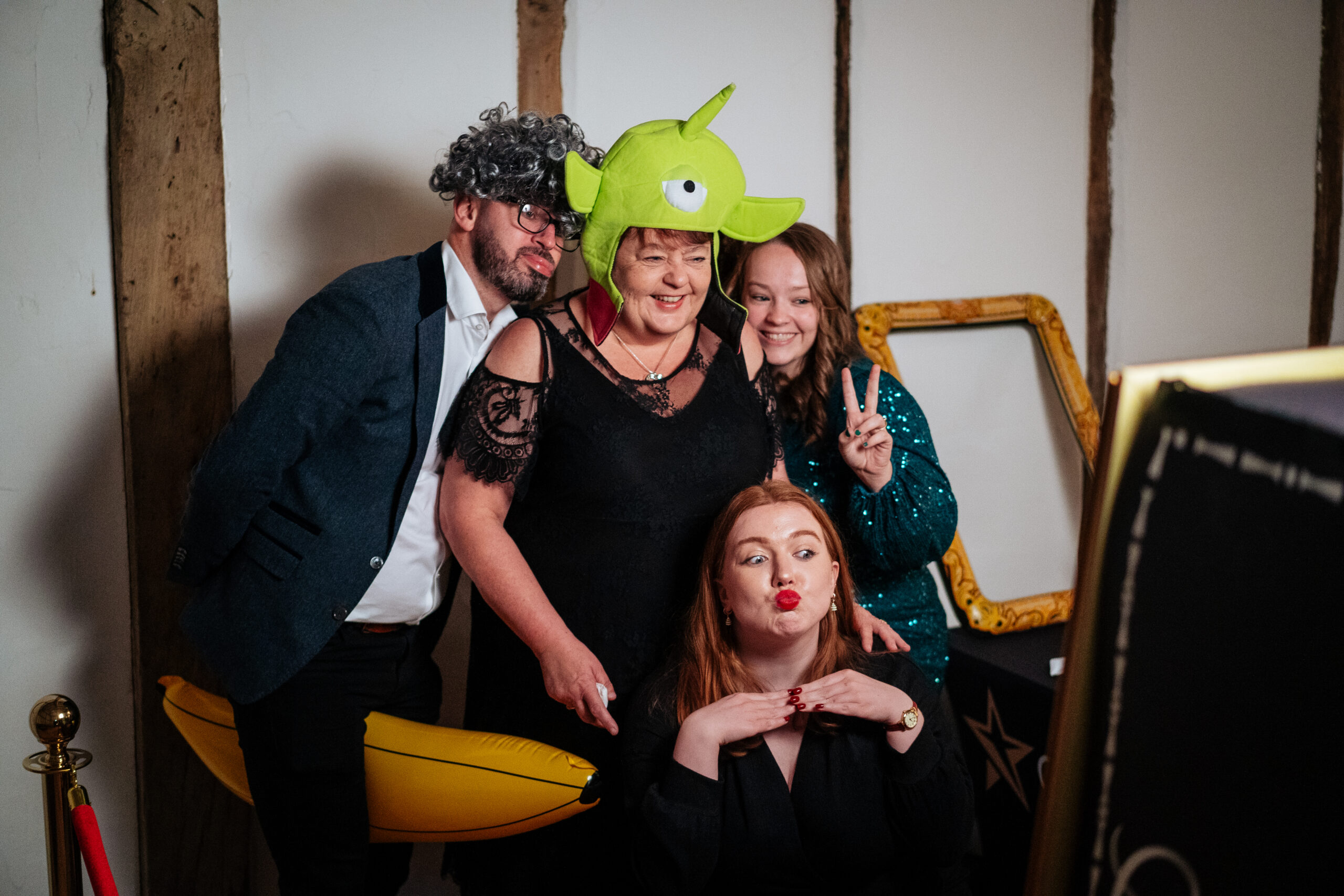 Guests enjoy photobooth at company Christmas party