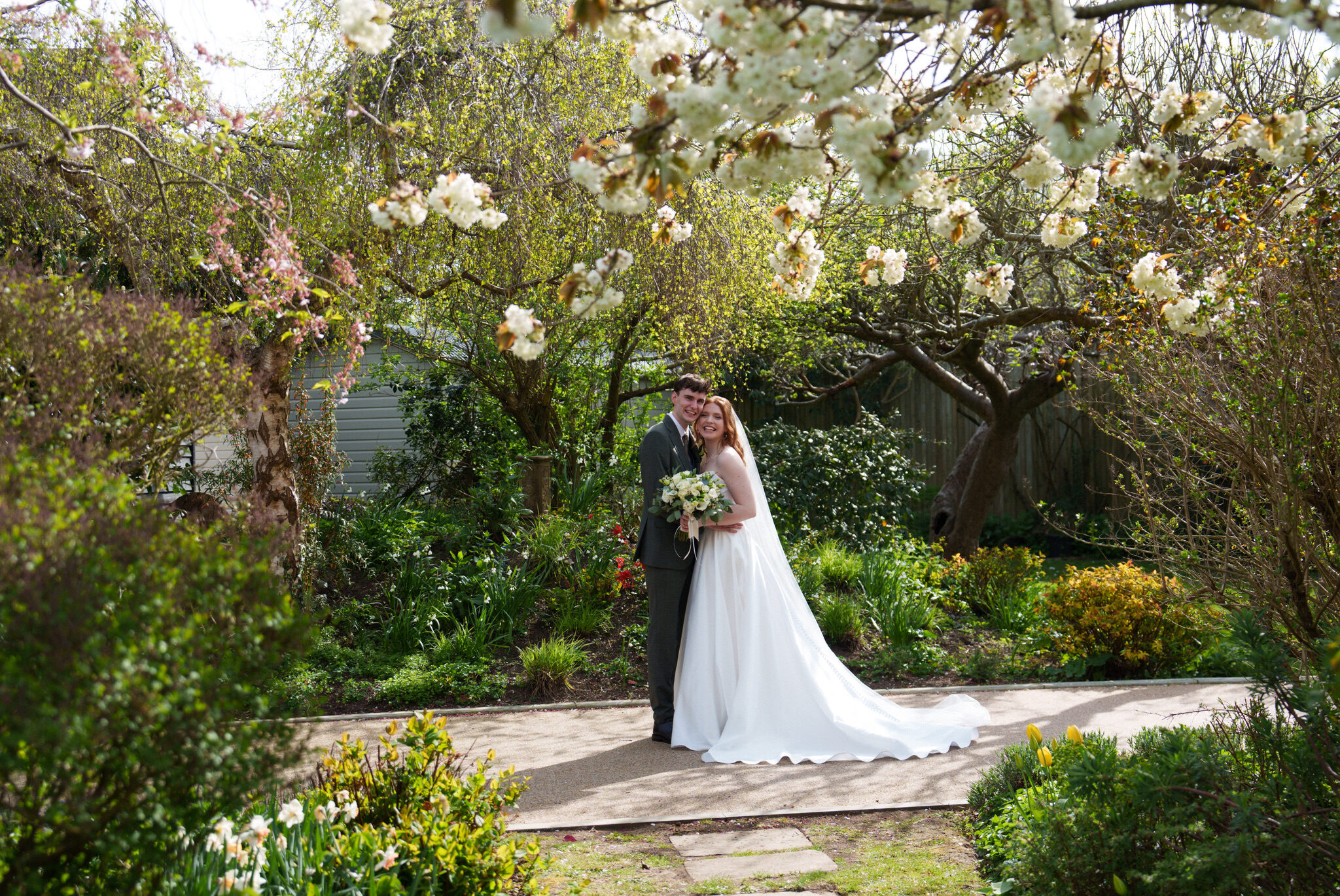 Wedding couple in the gardens at Alfriston Gardens