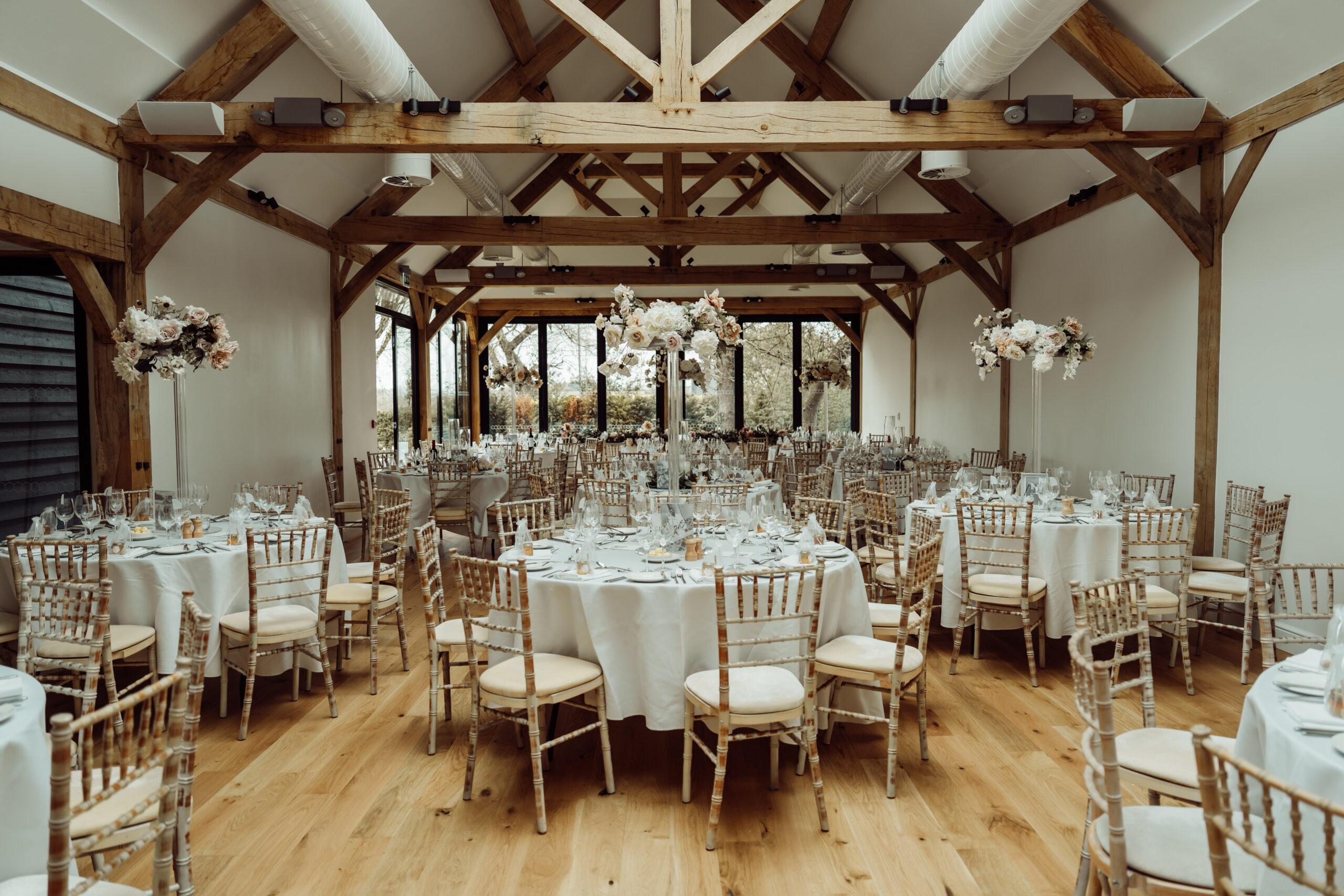 Classic wedding decor inside Alfriston Gardens wedding barn