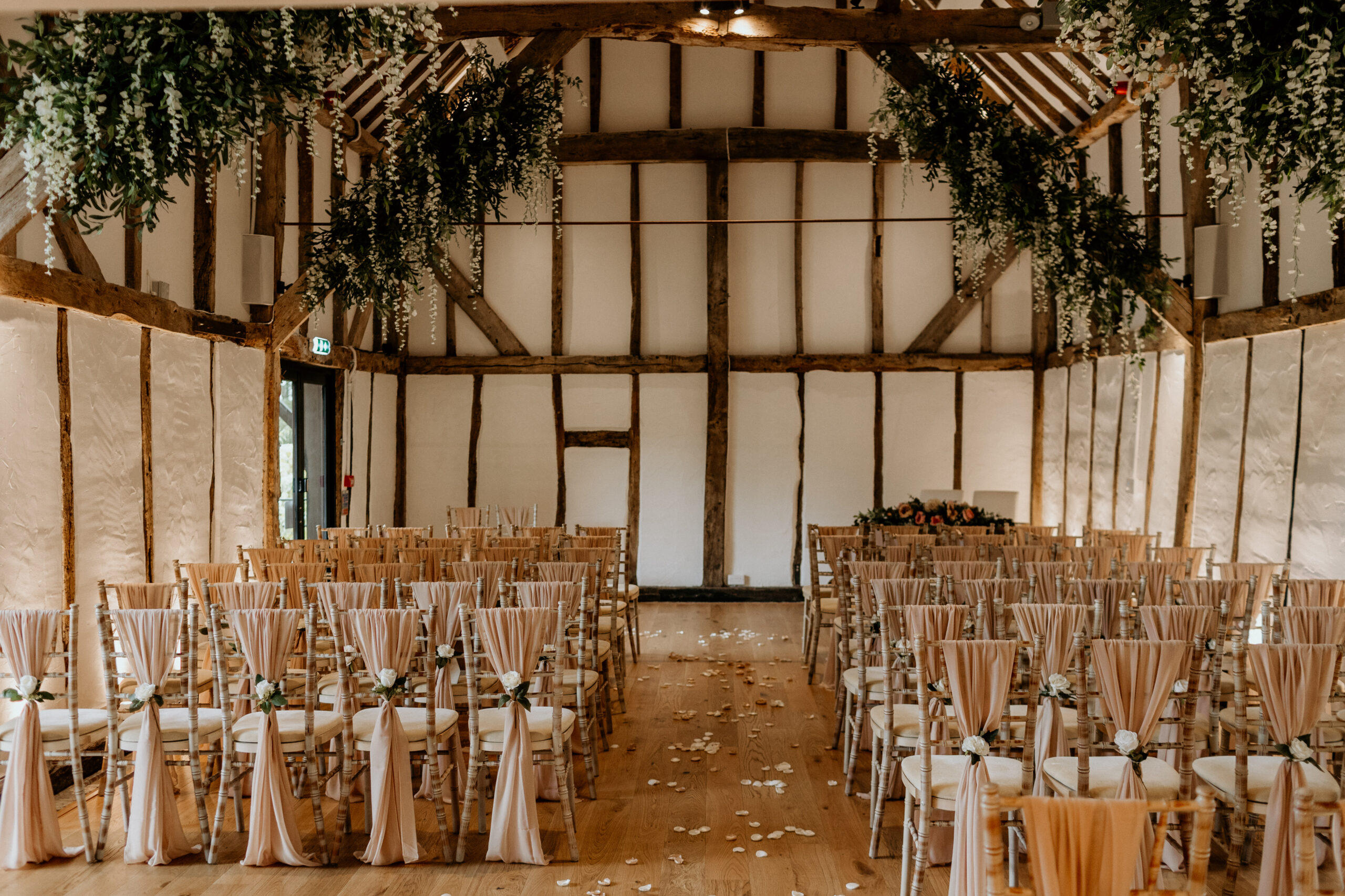 Alfriston Gardens Century Barn interior set for wedding ceremony