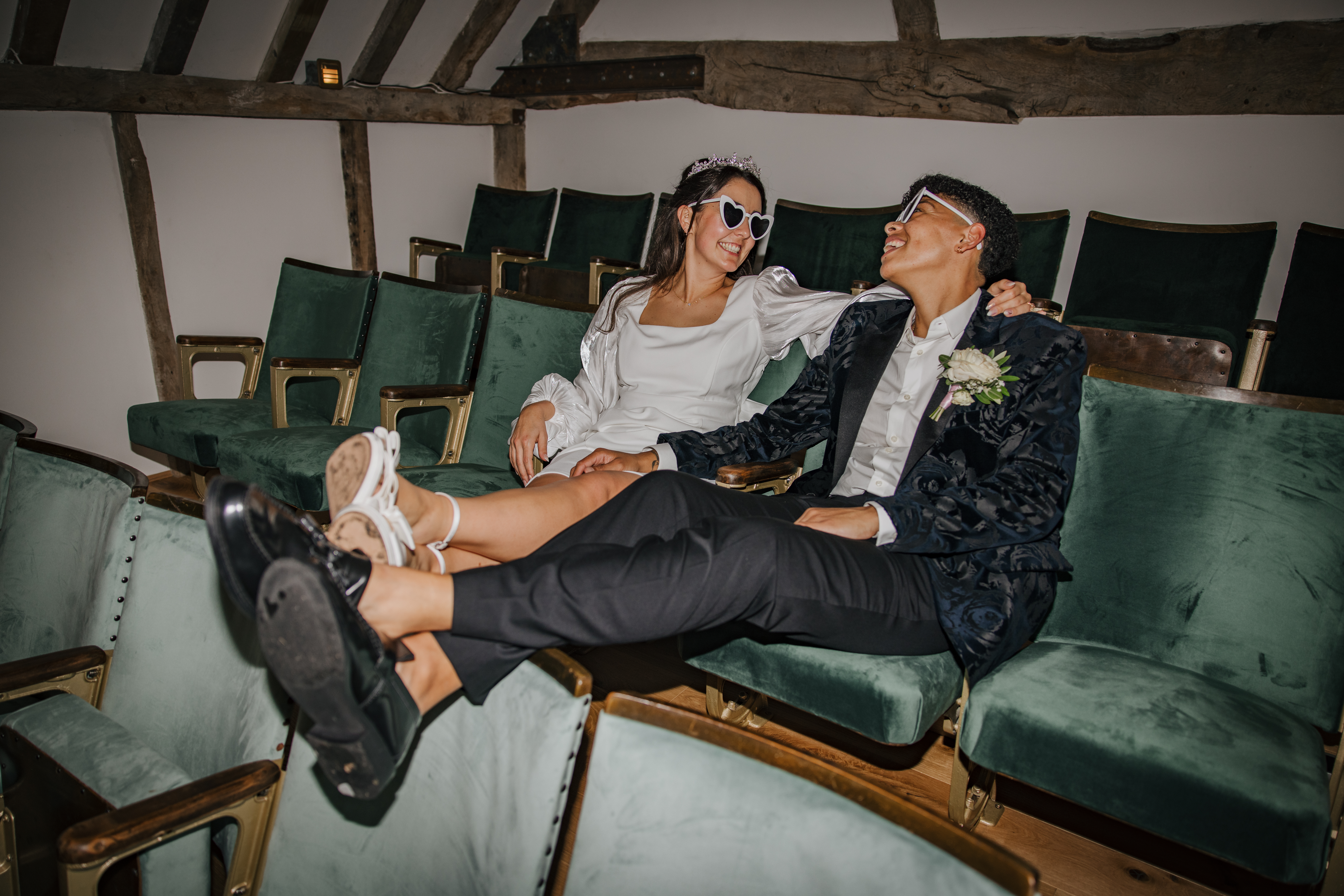 wedding couple posing for photos on balcony of Century barn